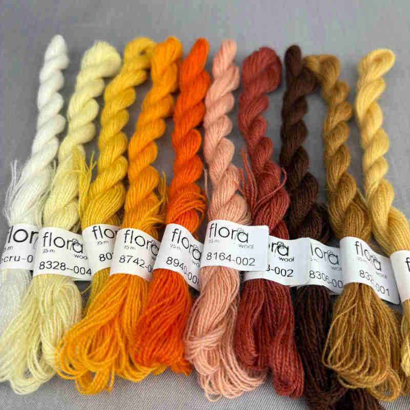 broderigarn i gule, orange og brune farver fra tekstilmagi